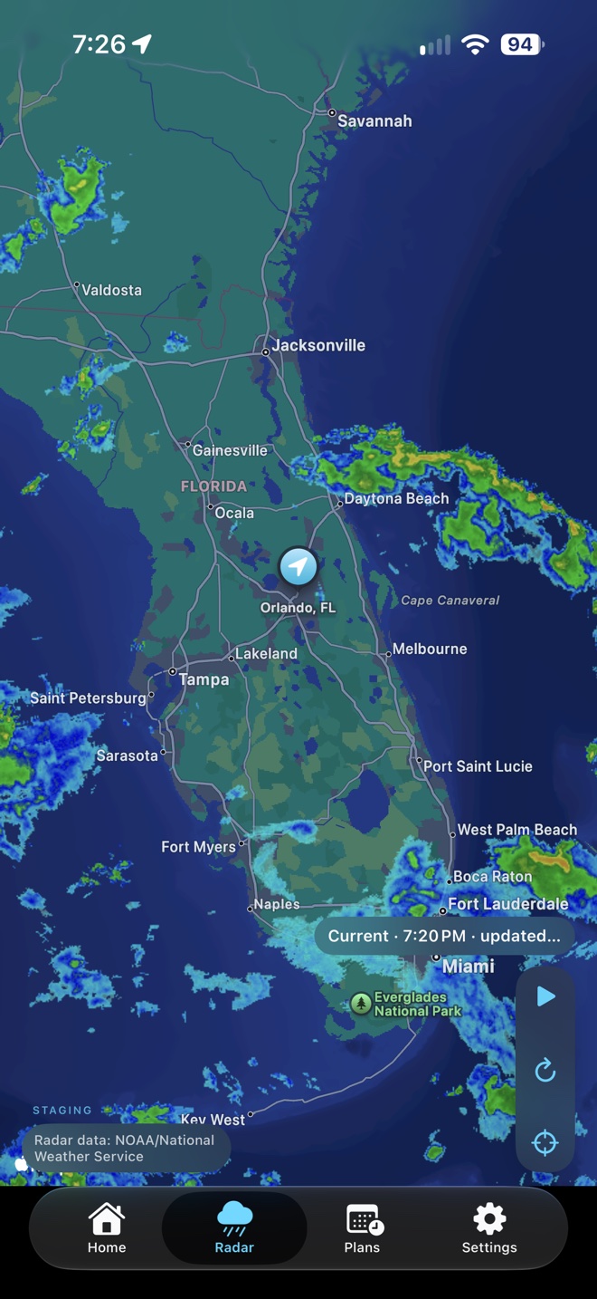 Weather Slate radar showing precipitation across Florida, centered near Orlando, with playback controls and NOAA/National Weather Service attribution.